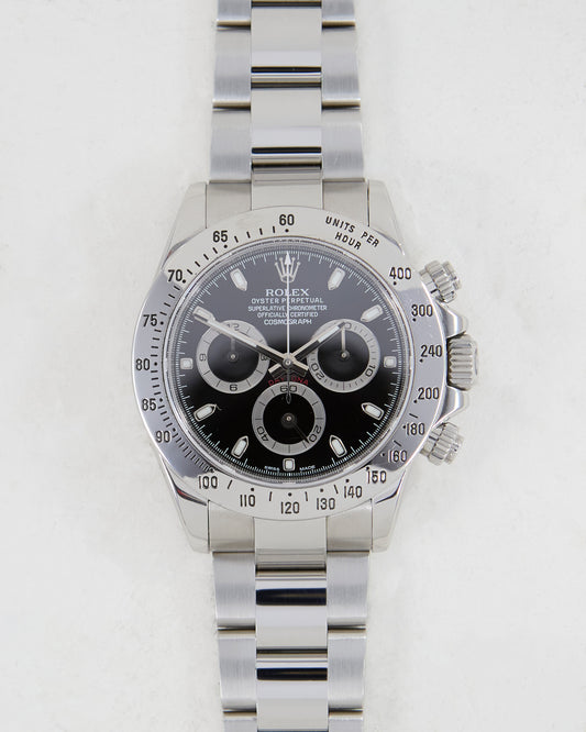 ROLEX DAYTONA BLACK DIAL IN STEEL ON OYSTER BRACELET WITH PAPERS