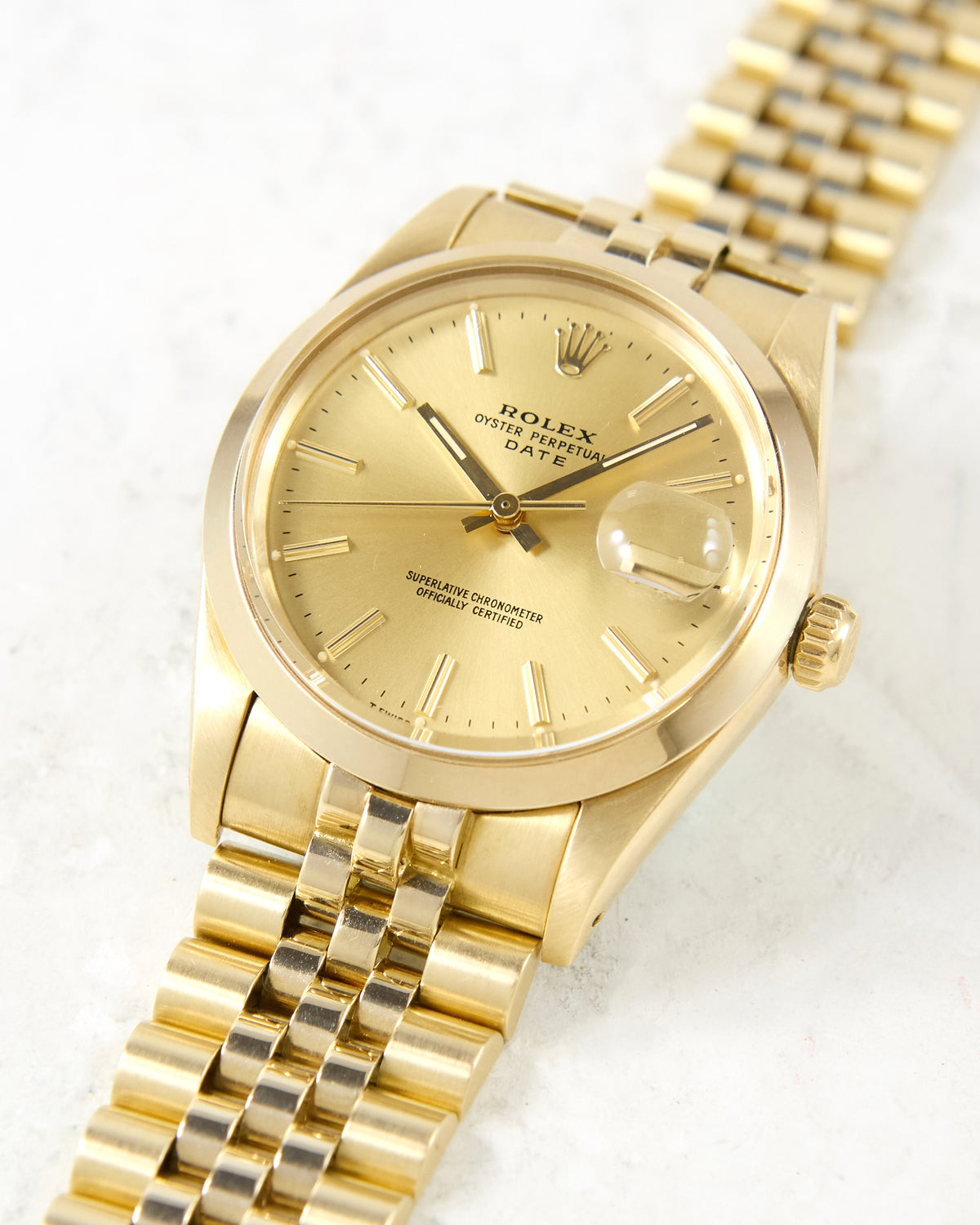 Rolex Date 15007 Smooth Bezel Champagne Dial in 14K Yellow Gold Case and Bracelet