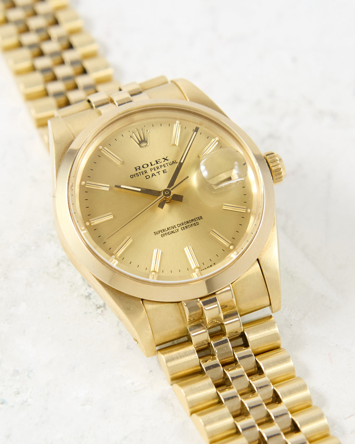 Rolex Date 15007 Smooth Bezel Champagne Dial in 14K Yellow Gold Case and Bracelet