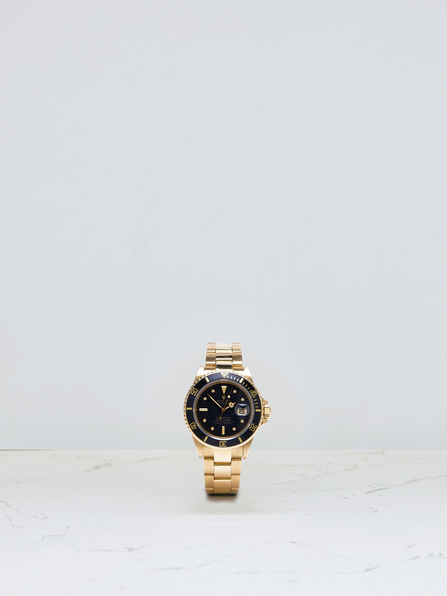 ROLEX SUBMARINER BLACK NIPPLE DIAL IN YELLOW GOLD