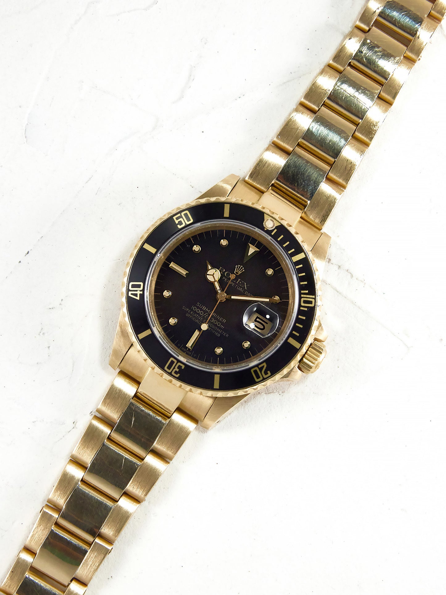 ROLEX SUBMARINER BLACK NIPPLE DIAL IN YELLOW GOLD