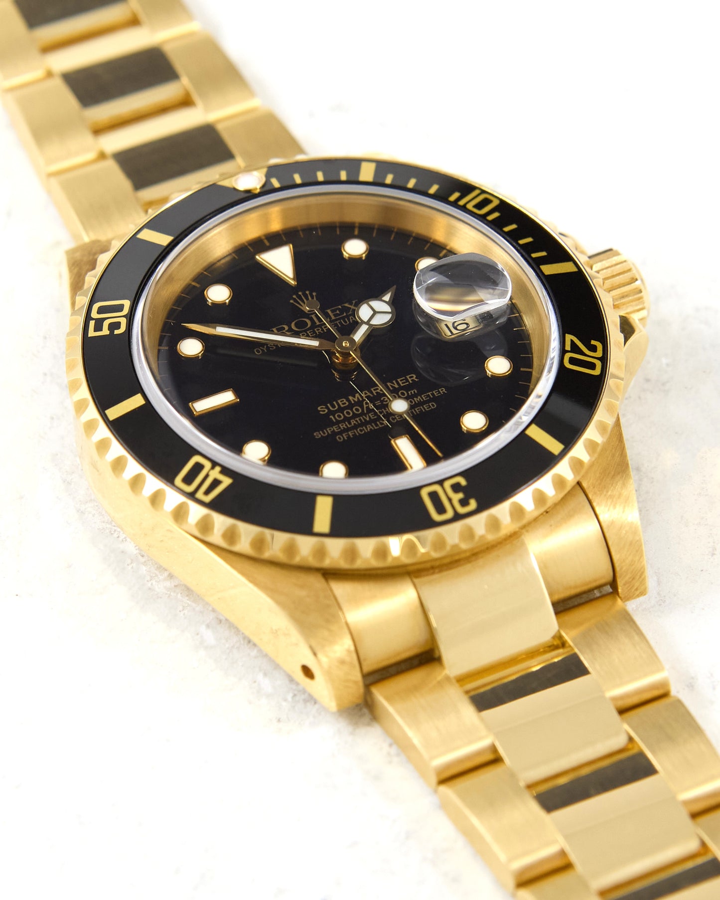 Rolex Submariner 16618 Black Dial in Yellow Gold with Box & Papers - New Old Stock Condition